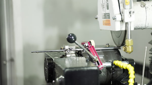 Peel grinding a carbide rod into a step drill blank.